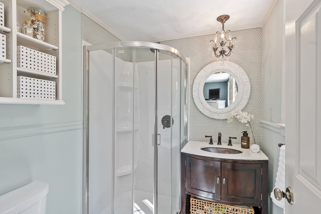 4 Prospect Hill Road Harvard, MA 01451 - Photo 19 of 37 a bathroom with a sink a mirror and a shower