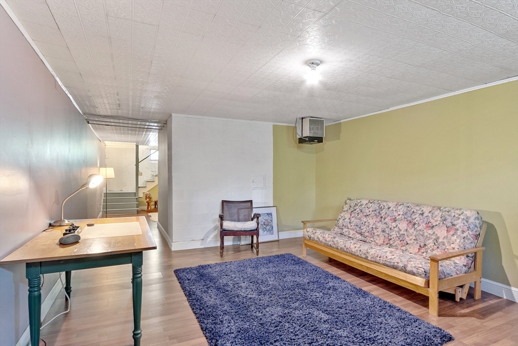 4 Prospect Hill Road Harvard, MA 01451 - Photo 25 of 37 a bedroom with a bed and wooden floor