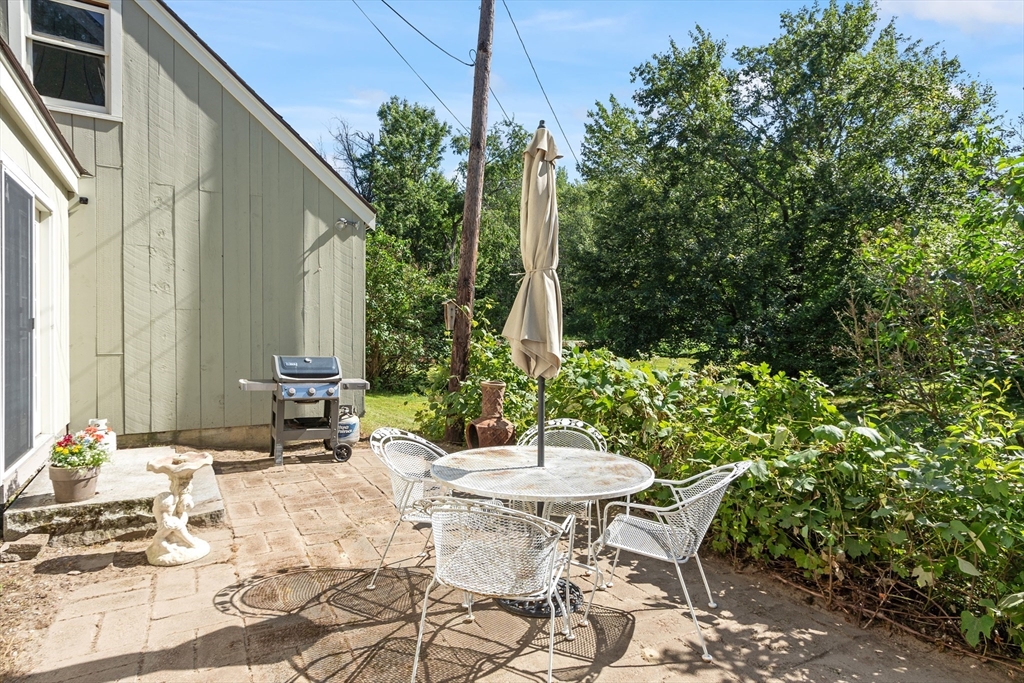 4 Prospect Hill Road Harvard, MA 01451 - Photo 34 of 37 a view of a patio with table and chairs and potted plants