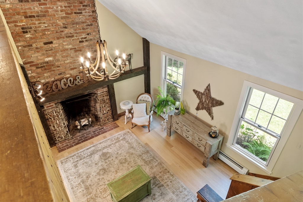 4 Prospect Hill Road Harvard, MA 01451 - Photo 7 of 37 a living room with furniture a fireplace and a flat screen tv