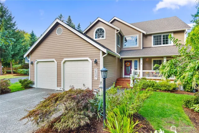 a front view of a house with garden