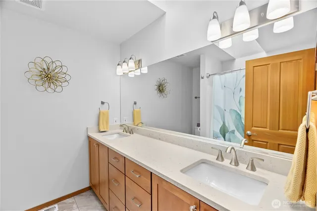 a bathroom with a sink a vanity and a mirror