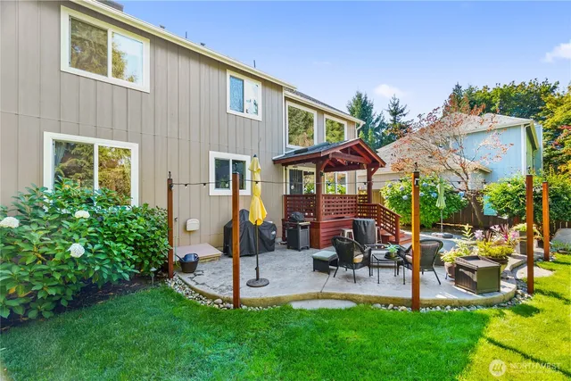 a front view of house with a garden and patio