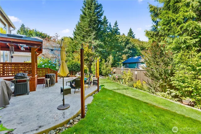 a view of a house with backyard porch and sitting area