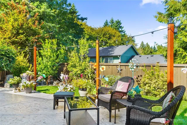 a view of a chairs and table in a patio