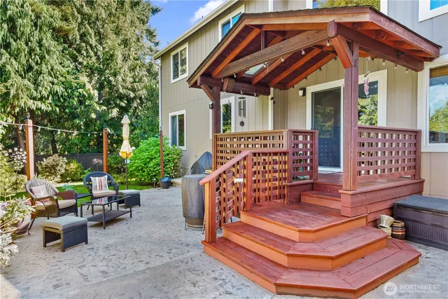 a balcony with furniture and potted plants