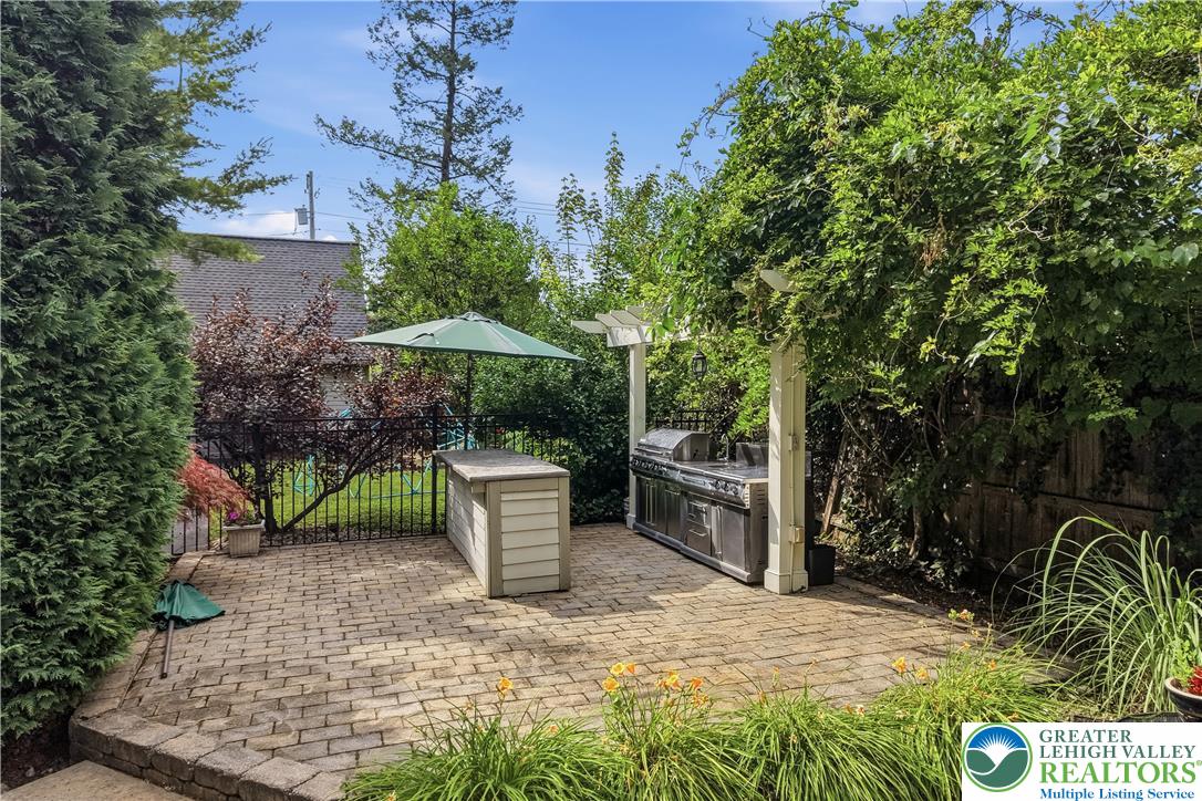 2014 Linden Street Bethlehem, PA 18017 - Photo 57 of 85 An inviting brick paver patio with a built-in outdoor kitchen, perfect for alfresco dining.