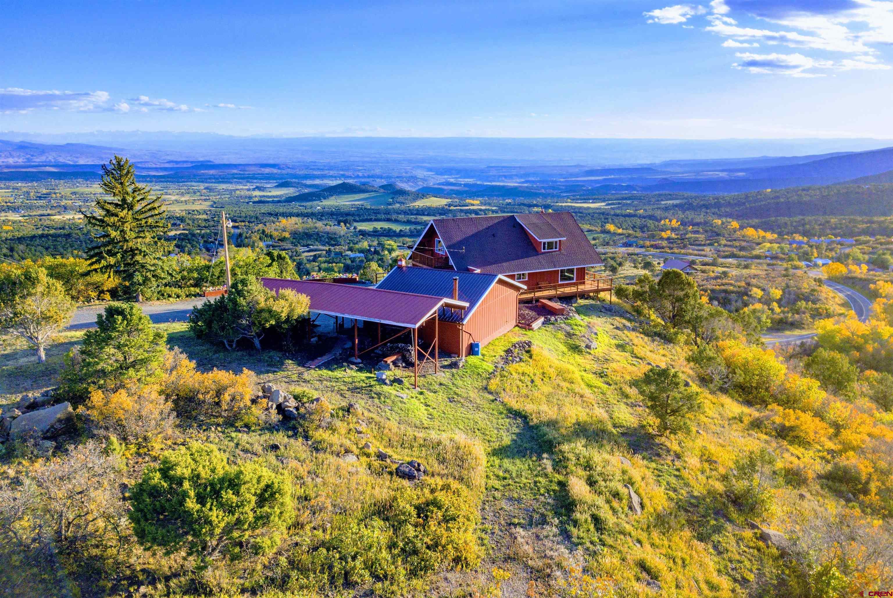 22211 Highway 65 Cedaredge, CO 81413 - Photo 3 of 35 an aerial view of a houses with a swimming pool