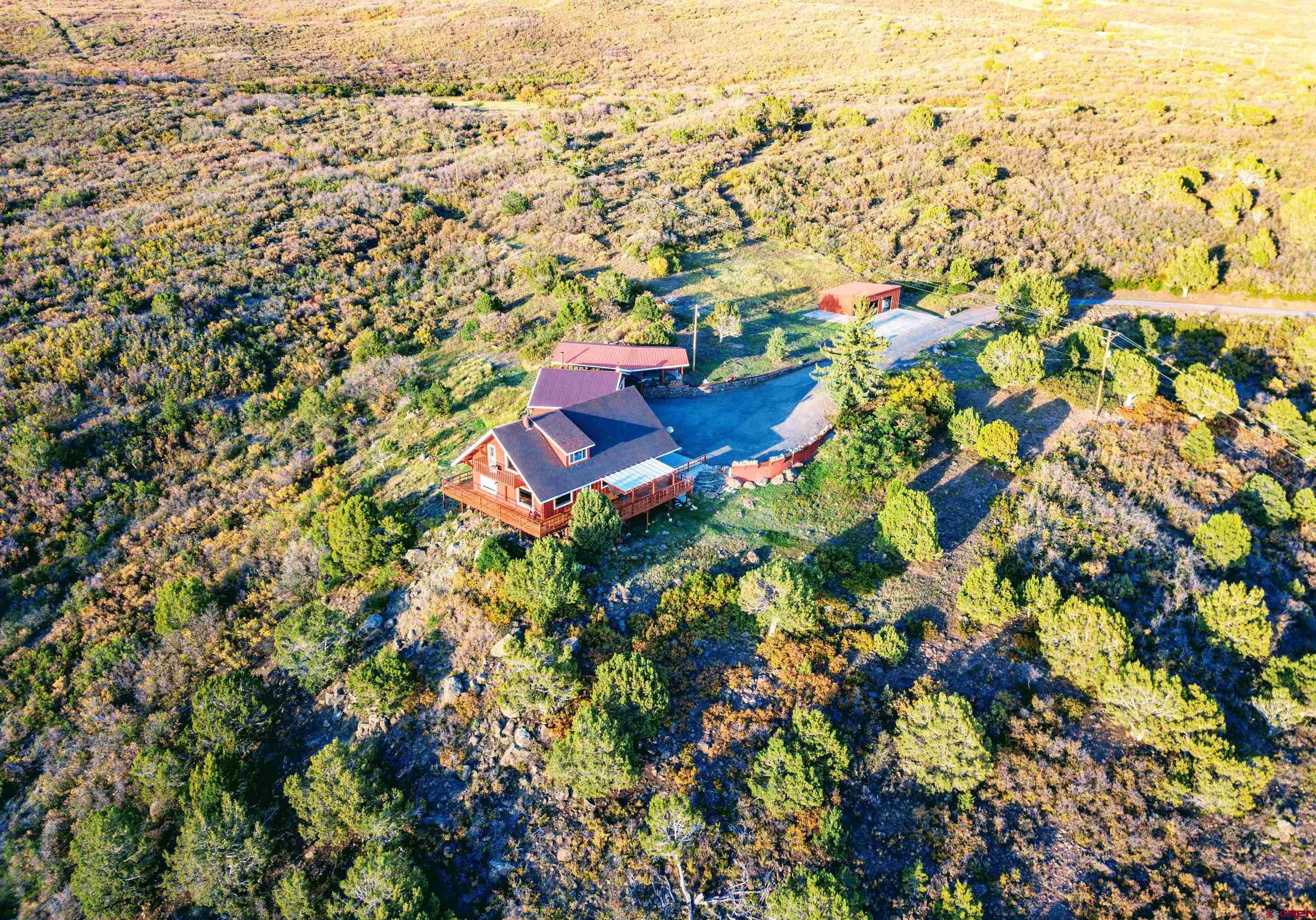 22211 Highway 65 Cedaredge, CO 81413 - Photo 8 of 35 an aerial view of residential houses with outdoor space