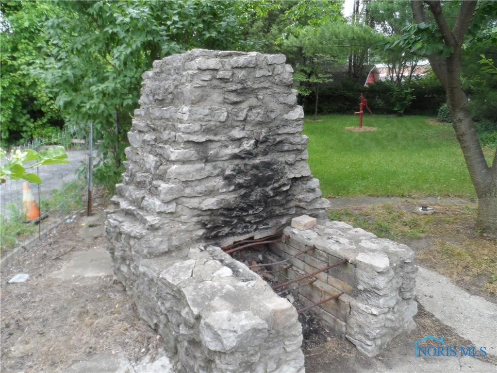 6022 Secor Road Toledo, OH 43613 - Photo 20 of 24 Fireplace is great for outdoor BBQ's