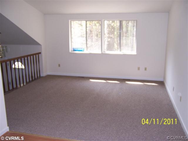10618 White Rabbit Road Richmond, VA 23235 - Photo 3 of 6 an empty room with a window