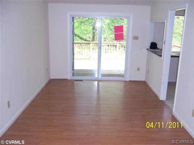 10618 White Rabbit Road Richmond, VA 23235 - Photo 4 of 6 a view of an empty room with a window