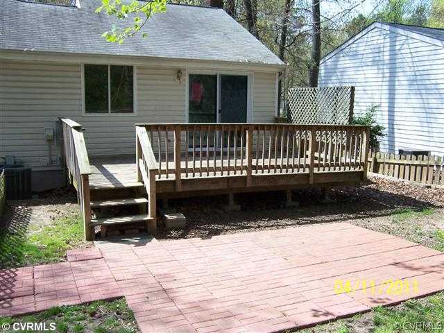 10618 White Rabbit Road Richmond, VA 23235 - Photo 6 of 6 a view of a wooden deck with a bench