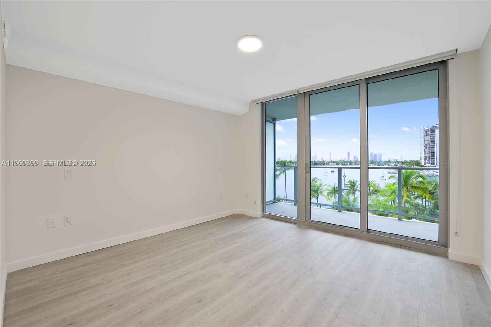 1504 Bay Road, Unit N1208 Miami Beach, FL 33139 - Photo 12 of 84 wooden floor in an empty room with a window