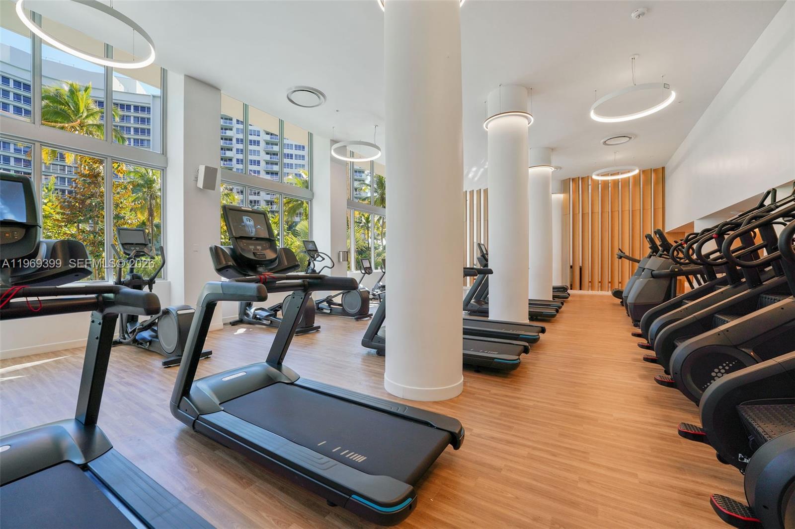 1504 Bay Road, Unit N1208 Miami Beach, FL 33139 - Photo 34 of 84 a room with gym equipment and a large window