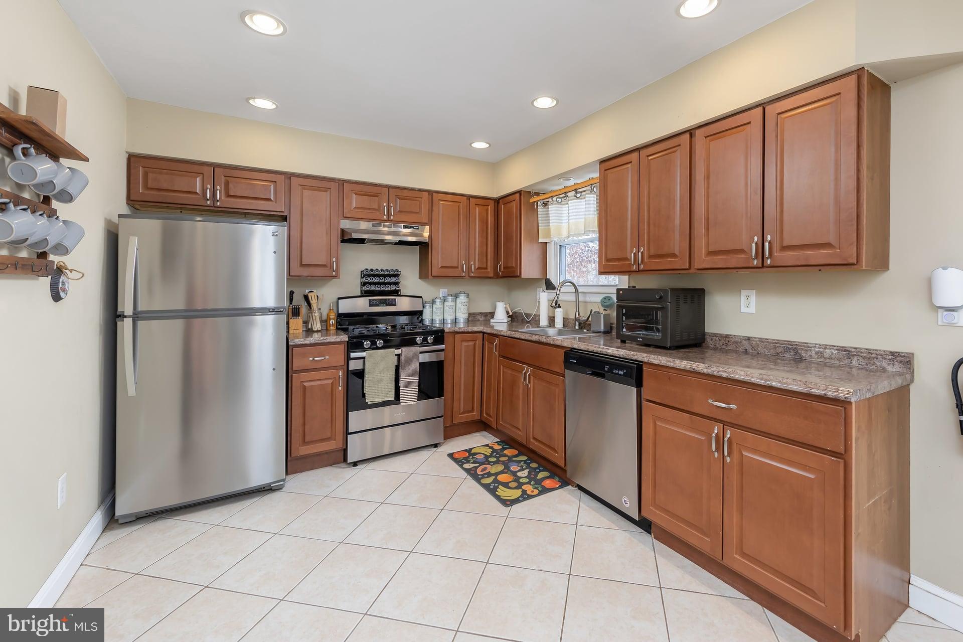 2311 Gennessee Avenue Atco, NJ 08004 - Photo 12 of 22 a kitchen with stainless steel appliances granite countertop a refrigerator sink and cabinets