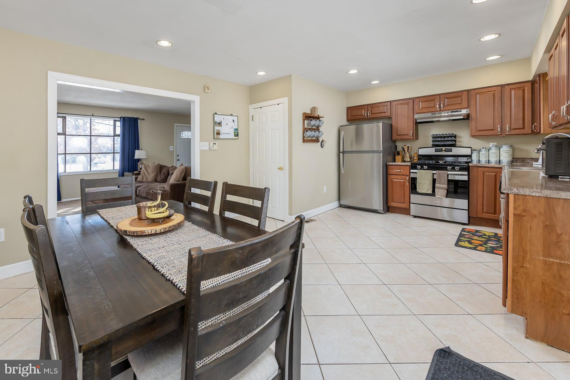 2311 Gennessee Avenue Atco, NJ 08004 - Photo 13 of 22 a view of kitchen with refrigerator stove dining table and chairs