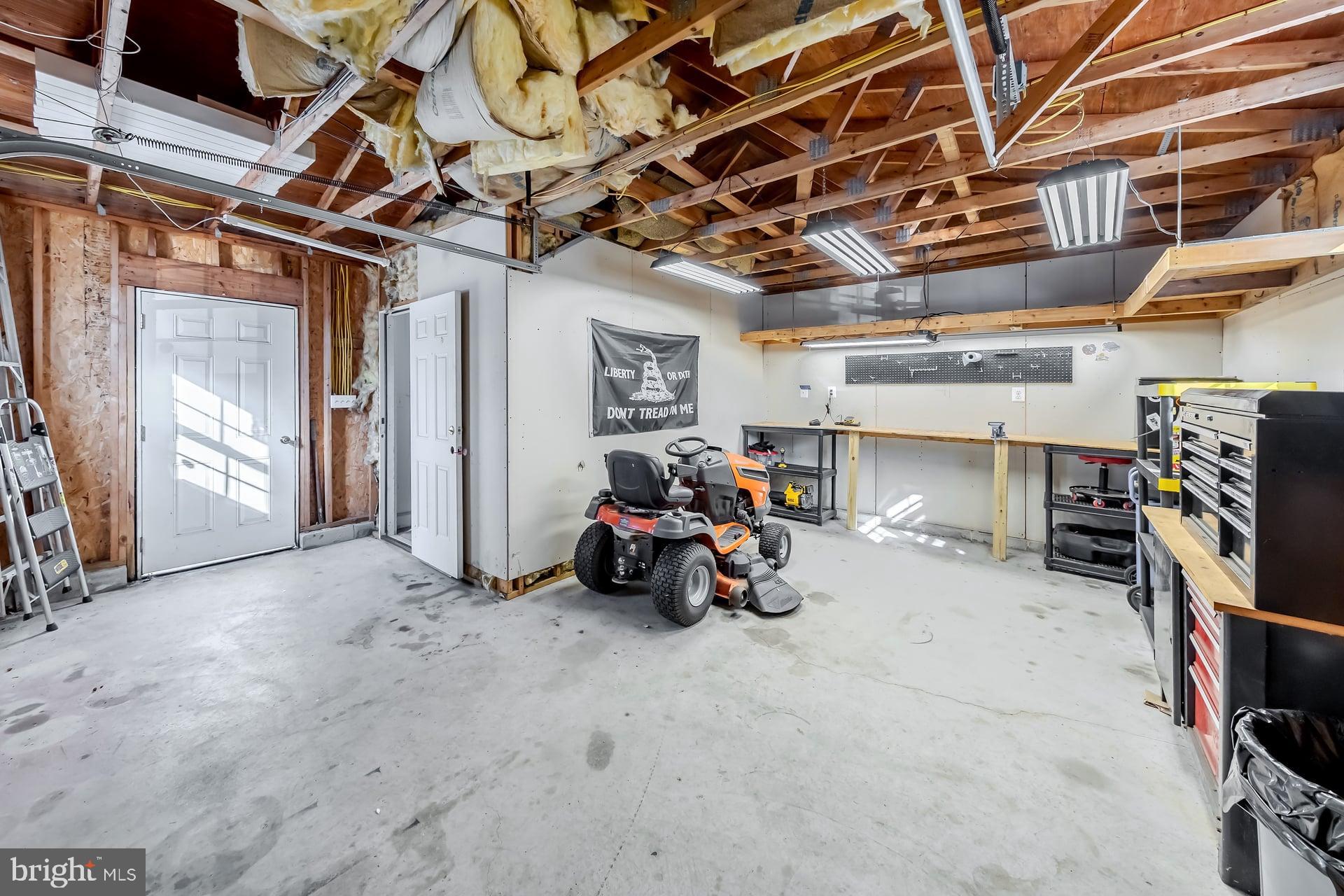 2311 Gennessee Avenue Atco, NJ 08004 - Photo 21 of 22 a view of a garage with a bike and car