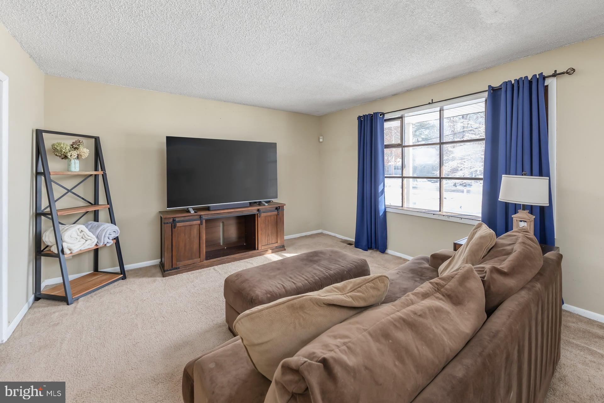 2311 Gennessee Avenue Atco, NJ 08004 - Photo 8 of 22 a bedroom with a bed and a flat screen tv