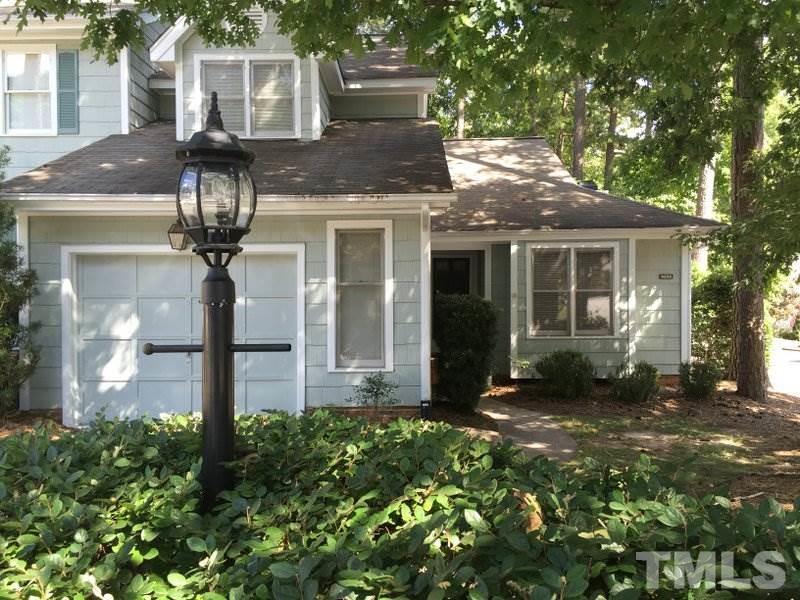 6239 Fountainhead Drive Raleigh, NC 27609 - Photo 1 of 17 a front view of a house with a yard