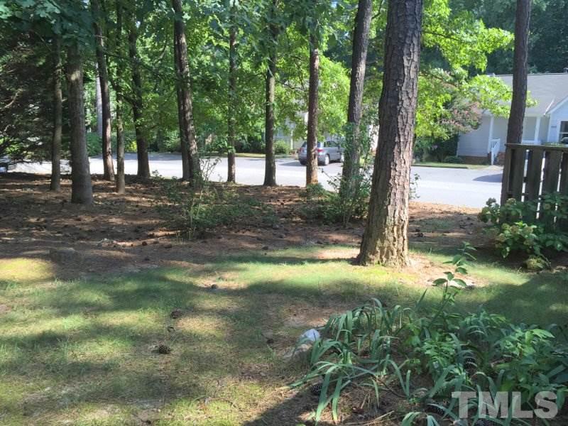 6239 Fountainhead Drive Raleigh, NC 27609 - Photo 14 of 17 a view of a tree in the middle of a yard