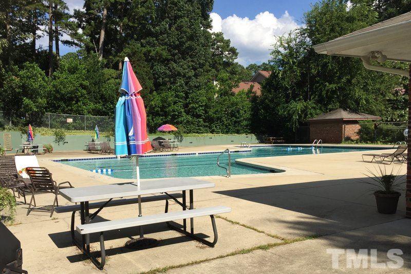 6239 Fountainhead Drive Raleigh, NC 27609 - Photo 16 of 17 a view of a swimming pool with a lounge chair