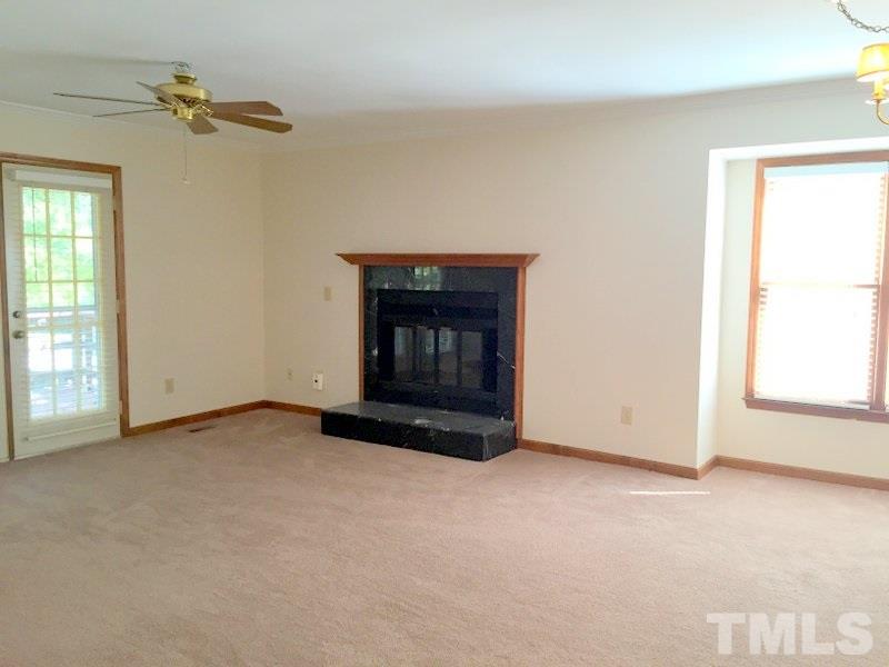 6239 Fountainhead Drive Raleigh, NC 27609 - Photo 3 of 17 an empty room with windows
