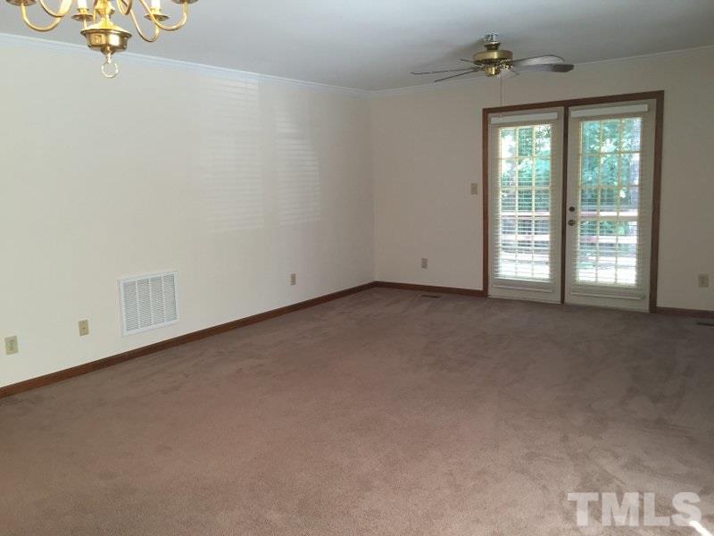 6239 Fountainhead Drive Raleigh, NC 27609 - Photo 5 of 17 a view of an empty room with a window
