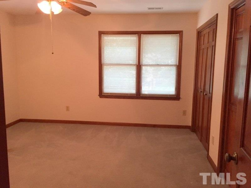 6239 Fountainhead Drive Raleigh, NC 27609 - Photo 10 of 17 an empty room with a window