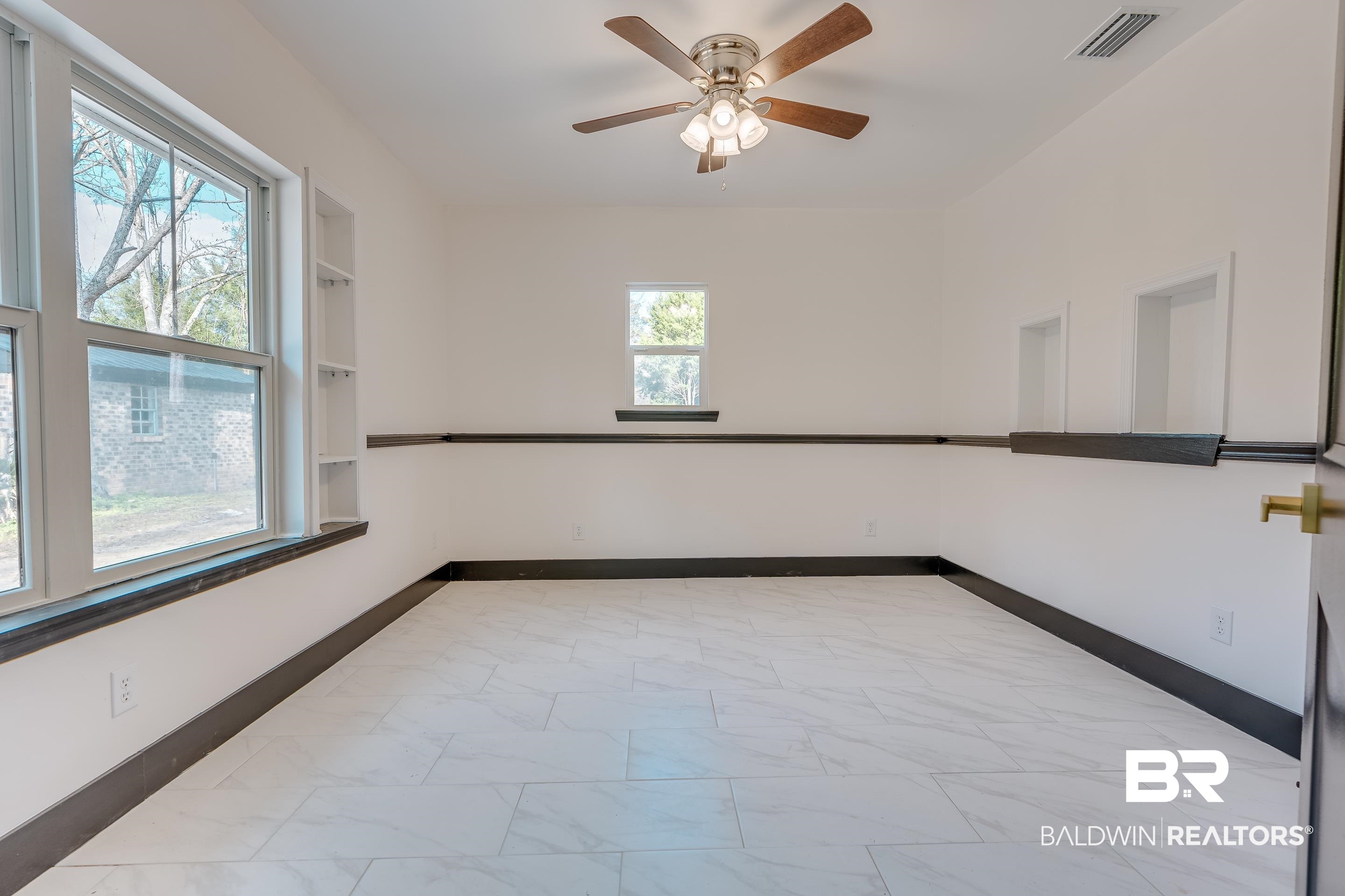 1190 Military Road Mount Vernon, AL 36560 - Photo 31 of 47 Unfurnished room with light marble finish flooring and ceiling fan