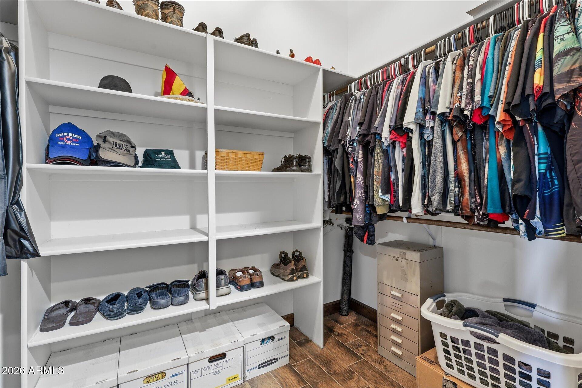 53 North La Barge Road Apache Junction, AZ 85119 - Photo 17 of 40 a view of walk in closet with clothes and shoes