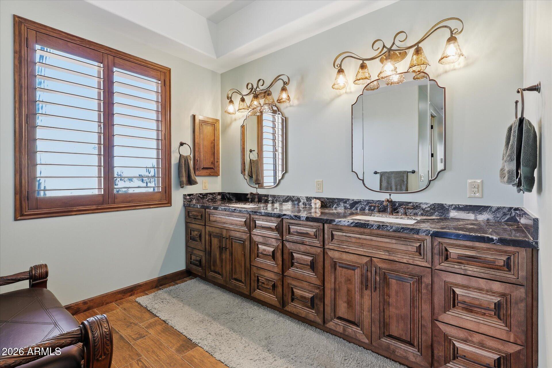 53 North La Barge Road Apache Junction, AZ 85119 - Photo 19 of 40 a bathroom with a sink and a mirror