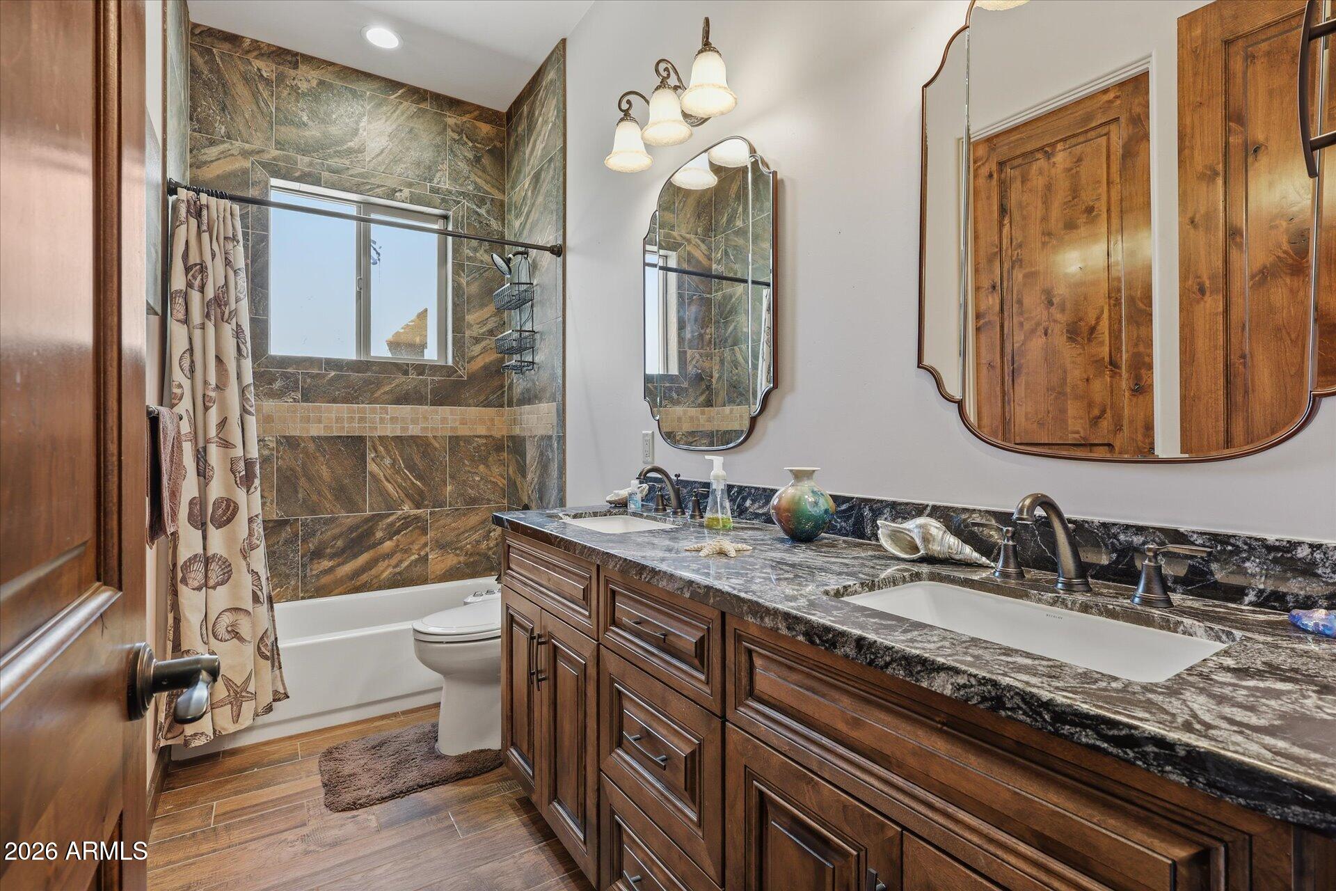 53 North La Barge Road Apache Junction, AZ 85119 - Photo 24 of 40 a bathroom with a granite countertop double vanity sink and a mirror