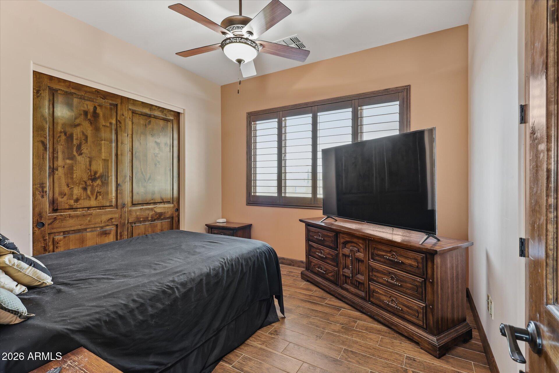 53 North La Barge Road Apache Junction, AZ 85119 - Photo 25 of 40 a bedroom with a bed and a flat screen tv