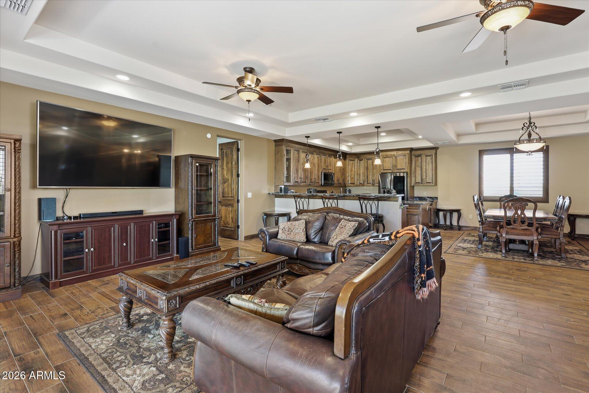 53 North La Barge Road Apache Junction, AZ 85119 - Photo 3 of 40 a living room with furniture and a flat screen tv