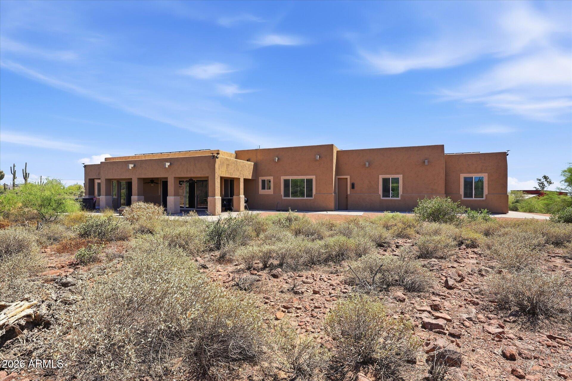 53 North La Barge Road Apache Junction, AZ 85119 - Photo 34 of 40 a front view of house with a garden