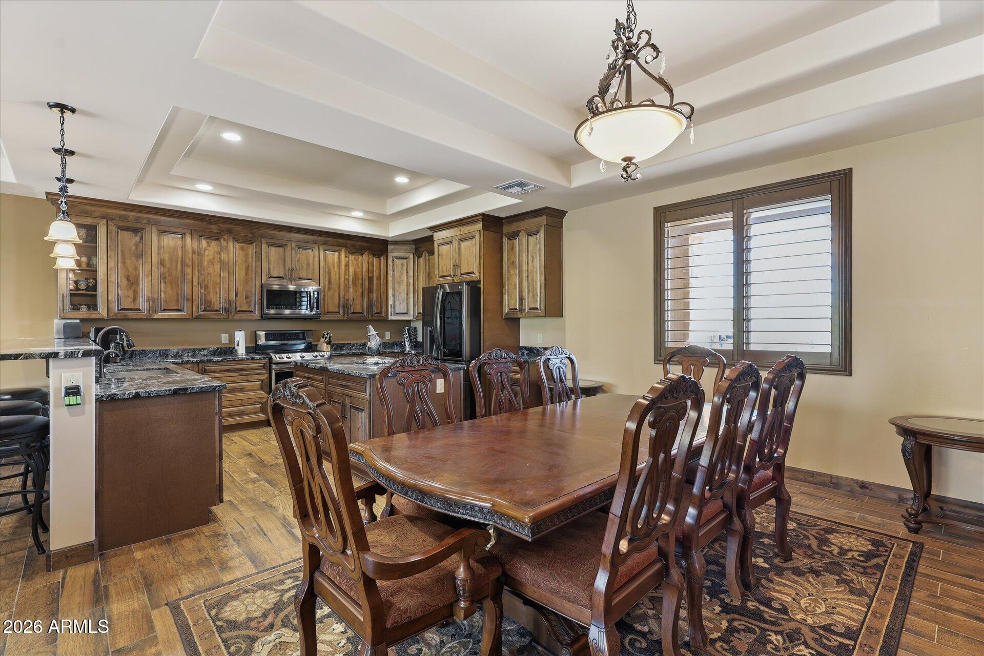 53 North La Barge Road Apache Junction, AZ 85119 - Photo 8 of 40 a view of a dining room with furniture window and wooden floor