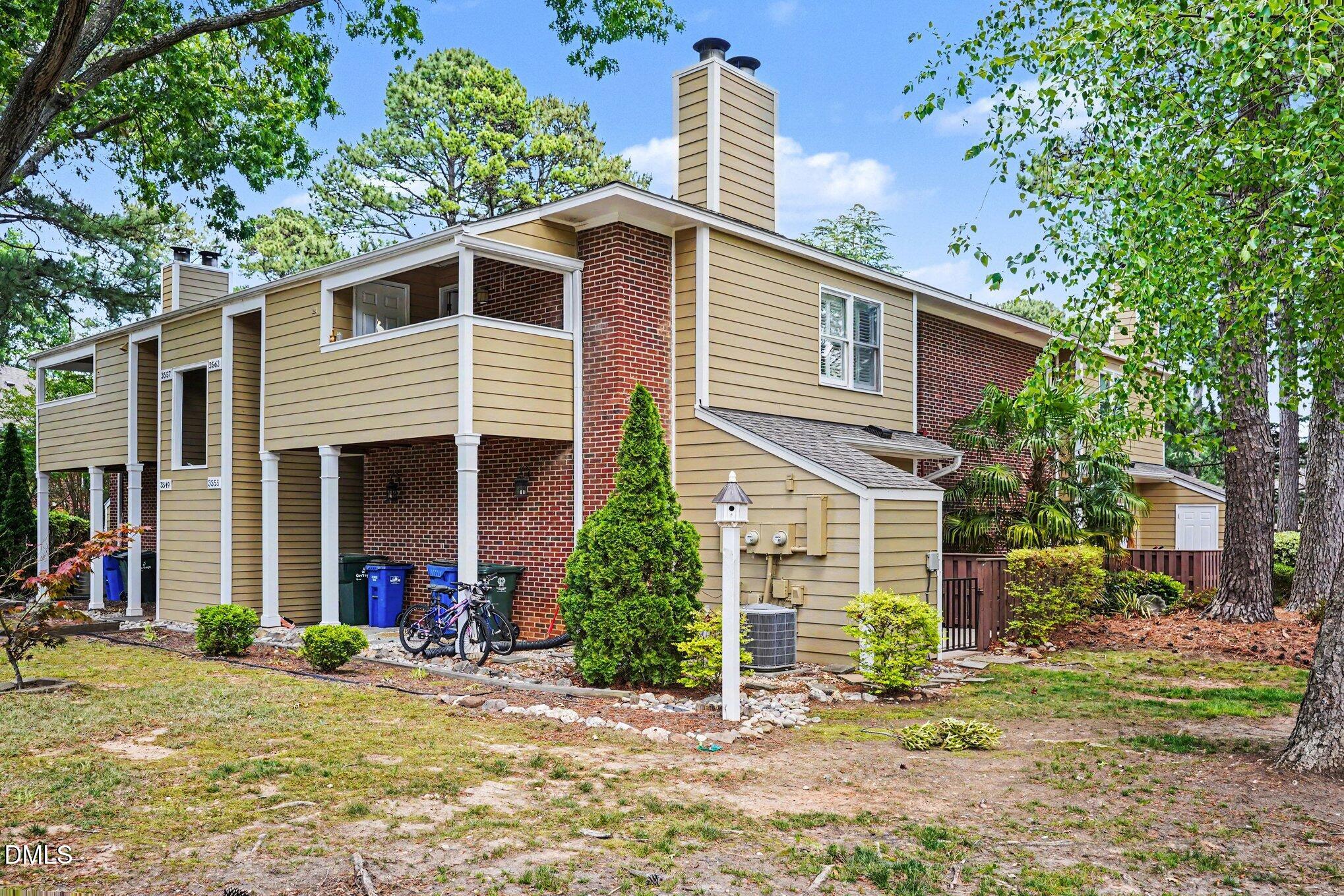 3555 Mill Run Raleigh, NC 27612 - Photo 16 of 25 a front view of a house with garden