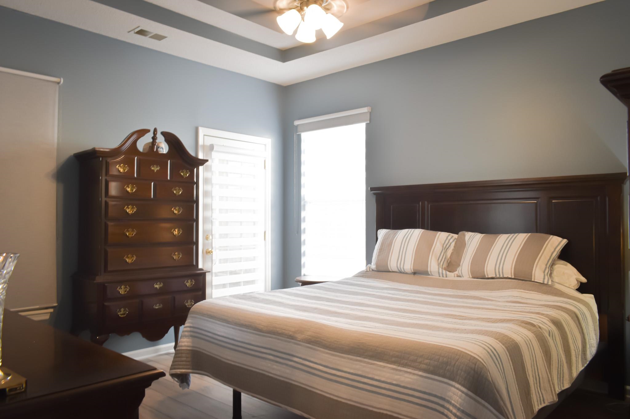 1670 Sedgefield Drive Murrells Inlet, SC 29576 - Photo 11 of 14 Bedroom with a raised ceiling and a ceiling fan