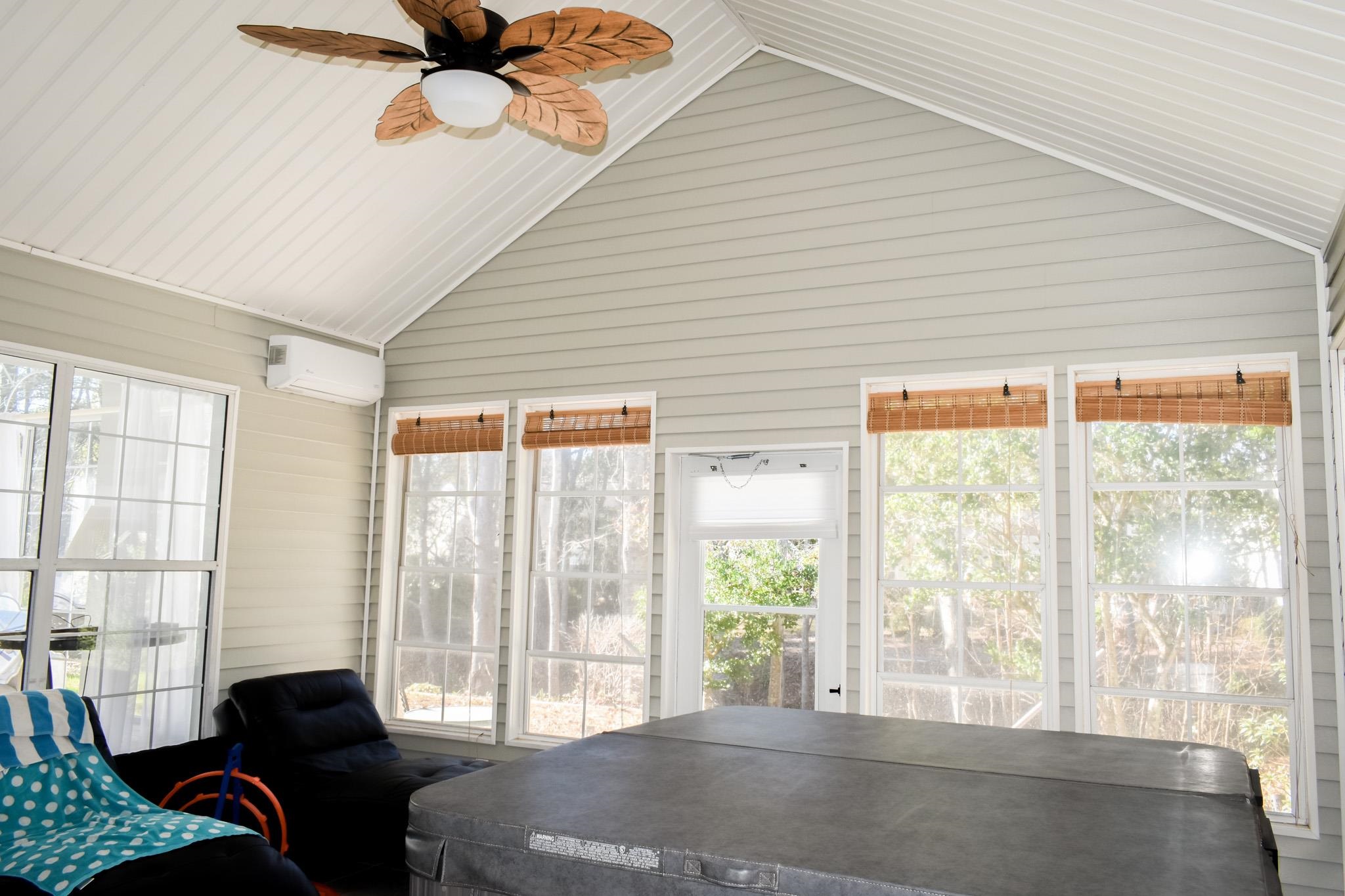 1670 Sedgefield Drive Murrells Inlet, SC 29576 - Photo 12 of 14 Sunroom with a ceiling fan, an AC wall unit, and lofted ceiling