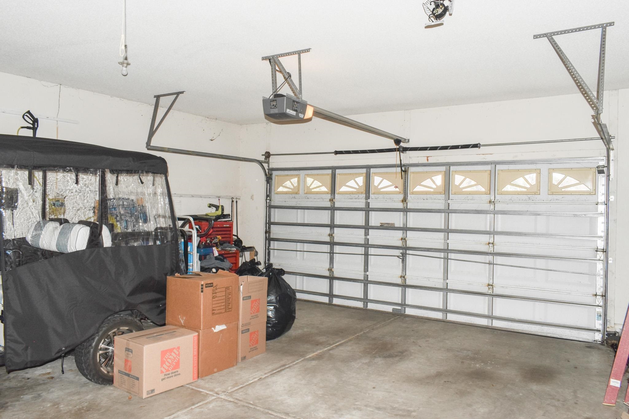 1670 Sedgefield Drive Murrells Inlet, SC 29576 - Photo 4 of 14 Garage featuring a garage door opener