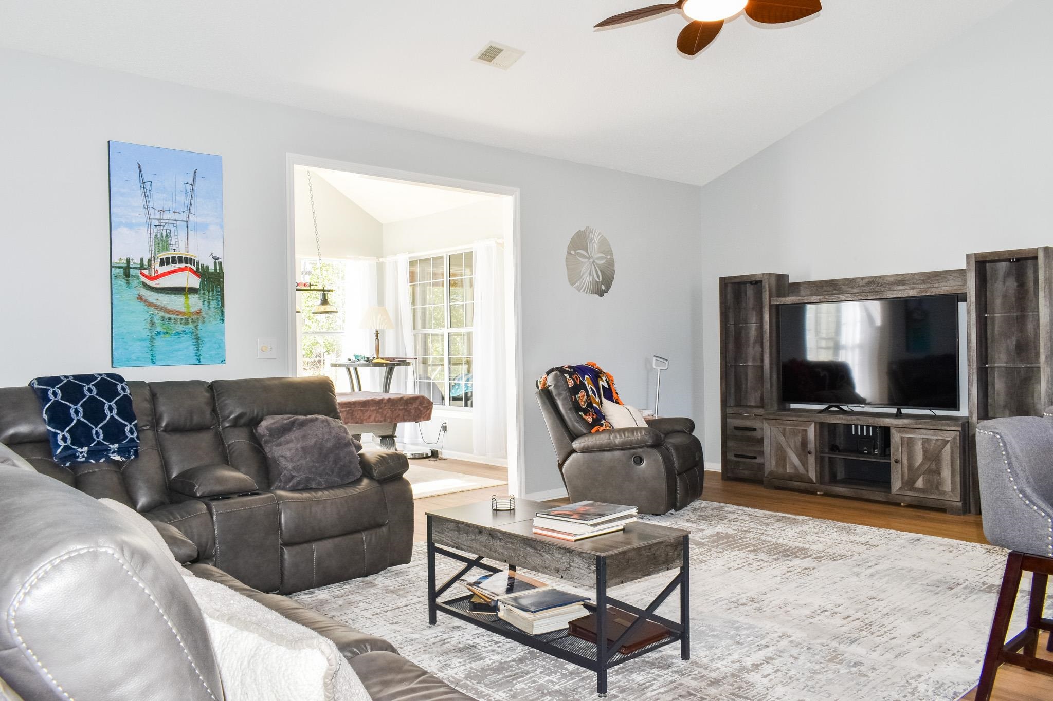 1670 Sedgefield Drive Murrells Inlet, SC 29576 - Photo 8 of 14 Living room with vaulted ceiling, wood finished floors, and a ceiling fan