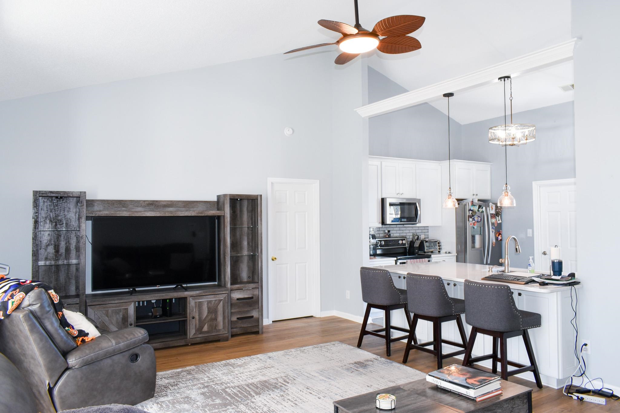 1670 Sedgefield Drive Murrells Inlet, SC 29576 - Photo 9 of 14 Living room featuring dark wood finished floors, high vaulted ceiling, and ceiling fan