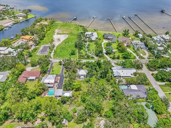 an aerial view of a house with a yard and garden