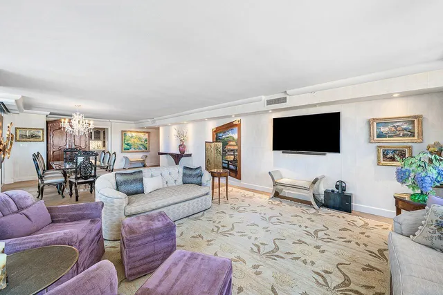 a living room with furniture a couch and a table