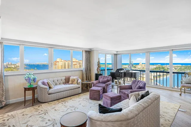 a kitchen with stainless steel appliances granite countertop a refrigerator a stove and a sink