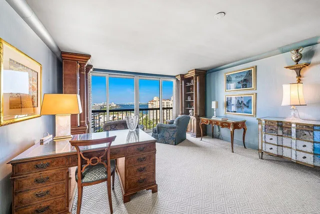 a spacious bathroom with a granite countertop sink a mirror and a