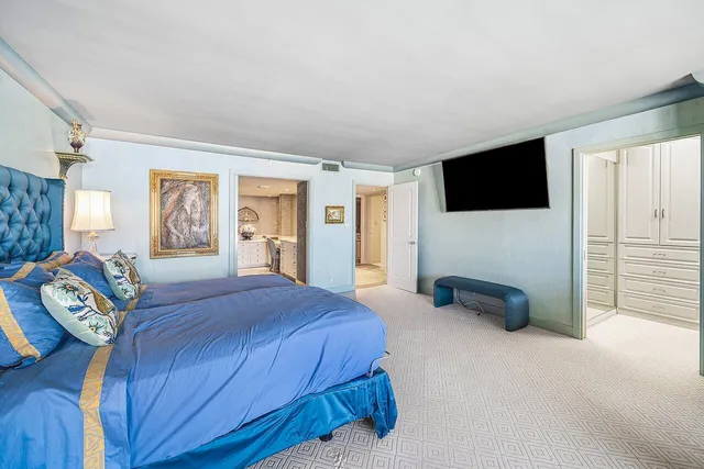 a bathroom with a granite countertop sink a mirror and shower
