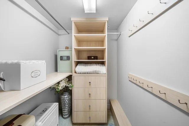 a bathroom with a granite countertop sink a toilet a mirror and shower
