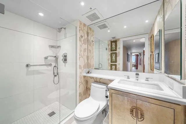 a swimming pool with outdoor seating and a garden